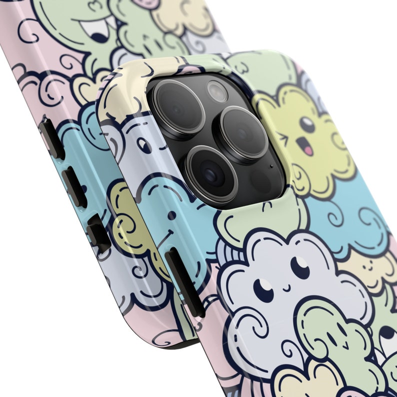 May include: A phone case with a colorful cartoon design featuring clouds with faces. The case has a cutout for the camera lens.