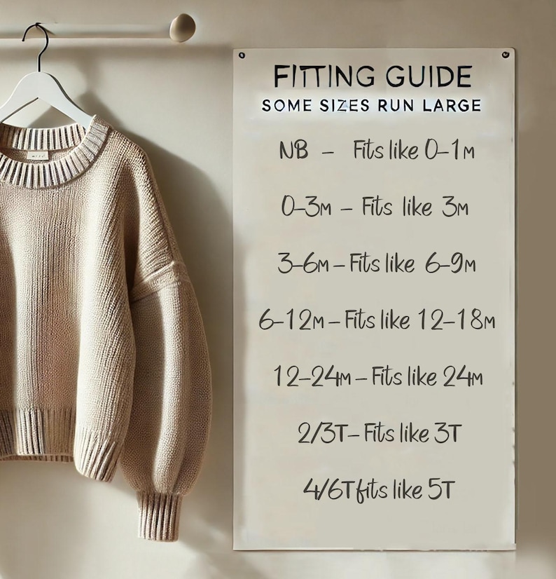May include: A beige long-sleeve knit sweater hangs on a white hanger next to a white sign titled FITTING GUIDE. The text reads: SOME SIZES RUN LARGE, NB - Fits like 0-1M, 0-3M - Fits like 3M, 3-6M - Fits like 6-9M, 6-12M - Fits like 12-18M, 12-24M - Fits like 24M, 2/3T - Fits like 3T, 4/6T fits like 5T.