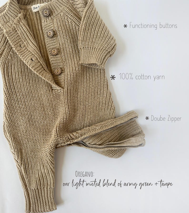 May include: A knitted baby romper in a light muted green and taupe color. The romper has a double zipper, functioning buttons, and is made of 100% cotton yarn.