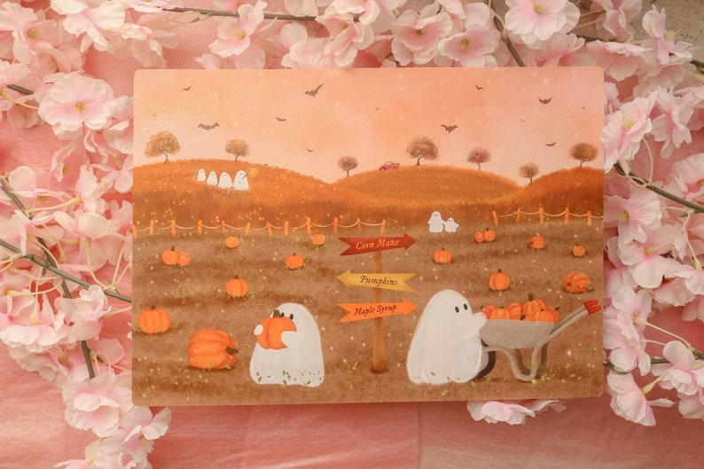 May include: A watercolor illustration of a fall scene with two ghosts in a pumpkin patch. One ghost is holding a pumpkin and the other is pushing a wheelbarrow full of pumpkins. There are signs pointing to "Corn Maze", "Pumpkins", and "Maple Syrup".