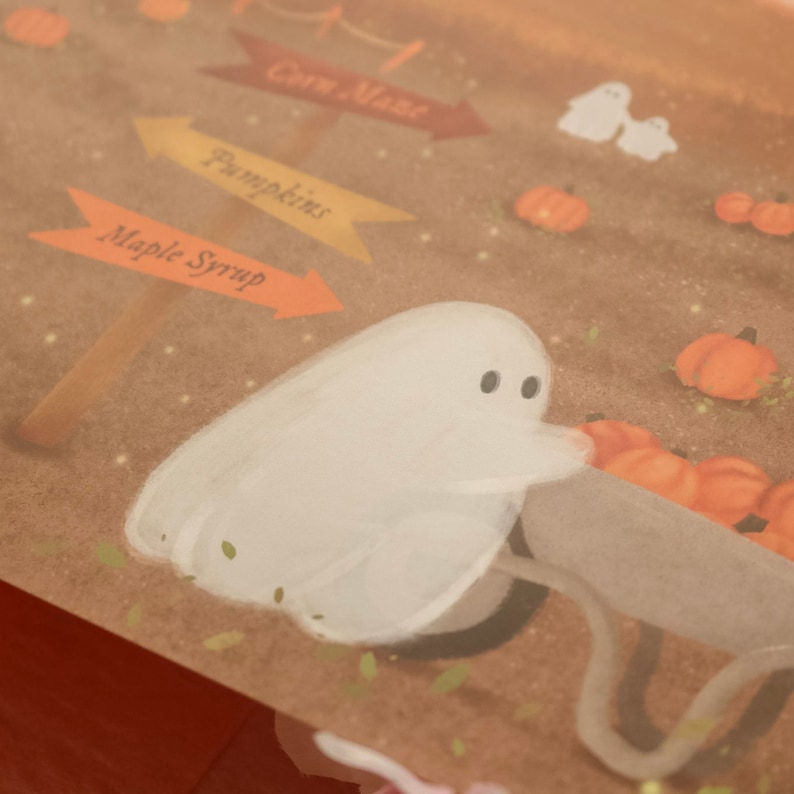 May include: A white ghost pushing a wheelbarrow full of pumpkins in a field with signs that say "Corn Maze", "Pumpkins", and "Maple Syrup".
