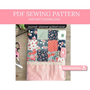 May include: A PDF sewing pattern for a quilted journal or planner cover. The cover is made of patchwork fabric with a variety of floral prints in pink, red, blue, and green. The cover has a pink fabric lining and a lace trim.