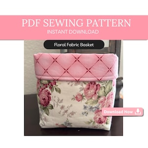 May include: A pink and white floral fabric basket sewing pattern. The pattern includes a pink fabric with a diamond pattern and a white fabric with a floral print. The text "Floral Fabric Basket" is visible in the image. Download Now.