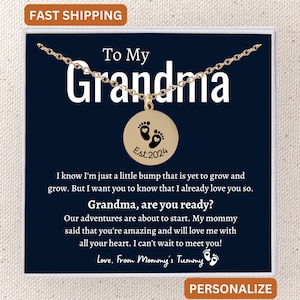 May include: A gold necklace with a round pendant that says "To My Grandma" and has a pair of baby footprints with a heart in the middle. The pendant also says "Est. 2024". The necklace is in a white box with a blue background.