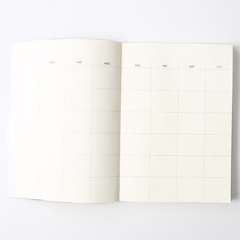 May include: An open blank weekly planner with a grid layout. The days of the week are labeled at the top: Mon, Tue, Wed, Thu, Fri, Sat, Sun.
