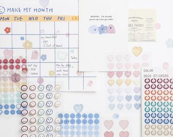 Può includere: Un foglio di adesivi a forma di cuore colorati con un foglio di adesivi con faccine sorridenti colorate. Gli adesivi a forma di cuore sono in tonalità di rosa, giallo e blu. Gli adesivi con faccine sorridenti sono in tonalità di rosso, arancione, giallo, verde, blu e marrone.