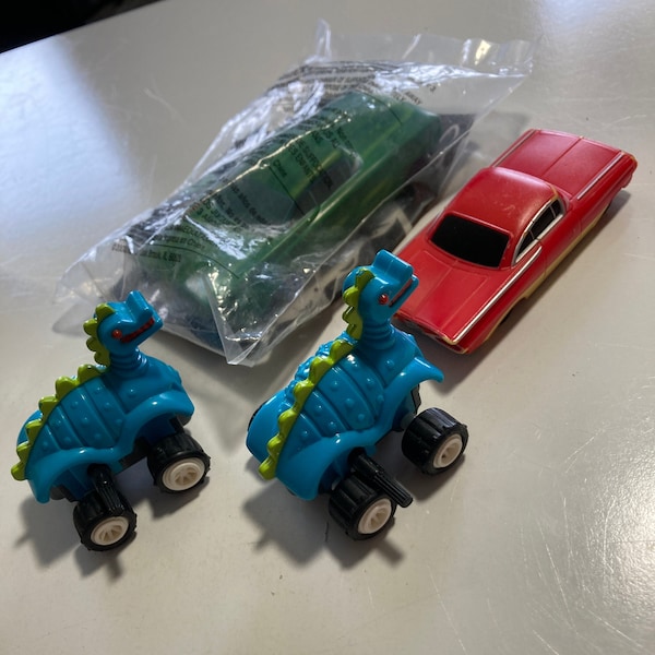 Toy car lot of 4 includes McDonald’s Disney Cars green Happy Meal Mattel toy Cars red Impala toy car Burger King Dino blue wind up