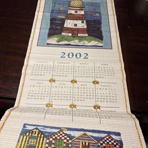 Vintage 2001 & 2002 straw mat style calendar plastic wood beach scene 30” long x 12.5” wide wall hanging
