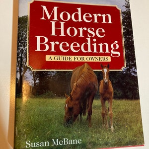May include: A book titled "Modern Horse Breeding: A Guide for Owners" by Susan McBane. The cover features a brown horse and a brown foal grazing in a green field.
