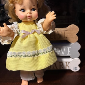 Horsman doll vintage 12” baby doll in original yellow dress and sheer pantaloons blond hair blue eyes vinyl plastic vintage 1970