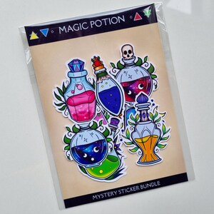 May include: A set of six colorful magic potion stickers with a galaxy design. The stickers are on a brown card with the text "Magic Potion" and "Mystery Sticker Bundle".