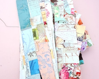 May include: A collection of rectangular paper bookmarks featuring a collage of vintage-style ephemera, including cursive handwriting, floral illustrations, botanical prints, ticket stubs, and aged document textures in shades of blue, pink, and cream.