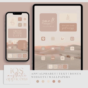 May include: A collection of aesthetic app icons for iOS devices. The icons are in a minimalist style with a beige and brown color scheme. The icons include apps like Instagram, TikTok, Twitter, and more. The background is a desert landscape with sand dunes.