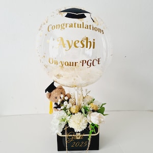 Graduation bouquet with flowers, a personalised balloon, chocolates and a teddy. (GB4)