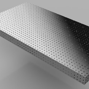 May include: A silver metal sheet with a pattern of small holes. The sheet is rectangular and has a gradient from light to dark.