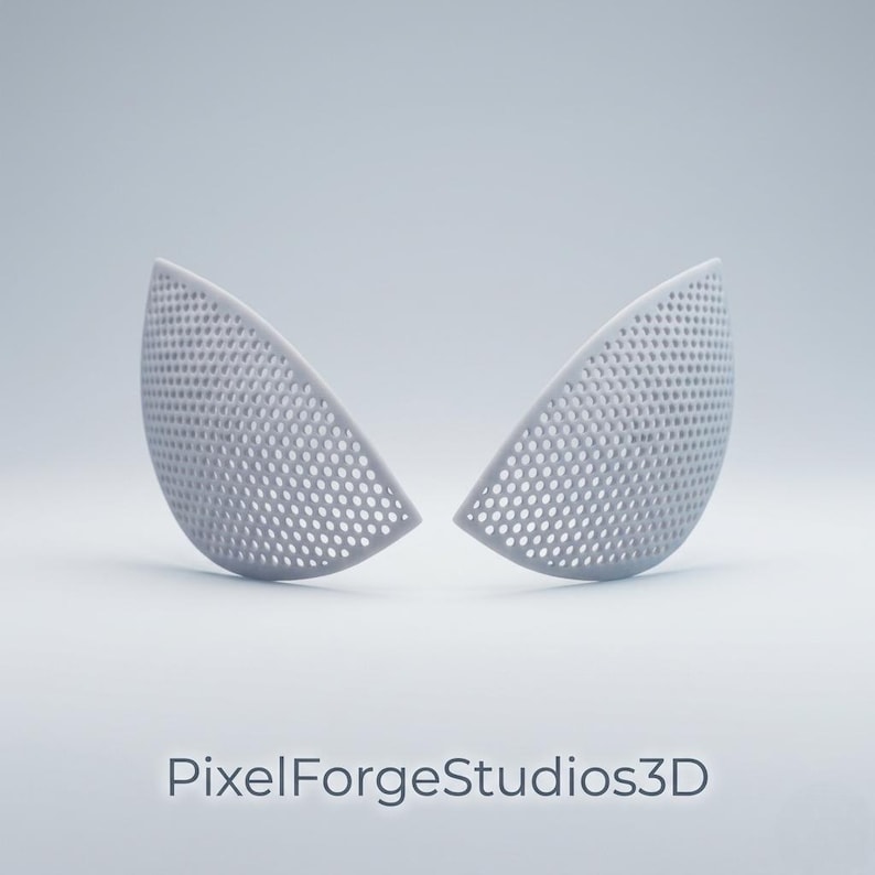 K&ouml;nnte beinhalten: Zwei graue, halbkreisf&ouml;rmige Objekte mit perforiertem Design, die Augenformen &auml;hneln, werden vor einem hellen Hintergrund dargestellt. Der Text "PixelForgeStudios3D" befindet sich unten.