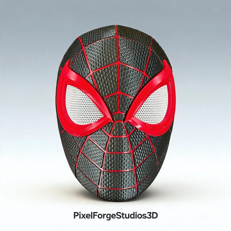 K&ouml;nnte beinhalten: Eine schwarze und rote Spider-Man-Maske mit wei&szlig;en Augenlinsen. Die Maske hat eine strukturierte Oberfl&auml;che mit rotem Netz und Akzenten. Die Augen&ouml;ffnungen sind rot umrandet. Die Maske bedeckt das gesamte Gesicht.