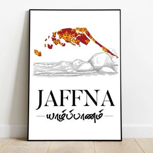 May include: A white poster with a black frame features a stylised map of Jaffna, Sri Lanka, with a red and gold flag design. The text "JAFFNA" is printed in black below the map, and the Tamil name for Jaffna is printed in black below the text.