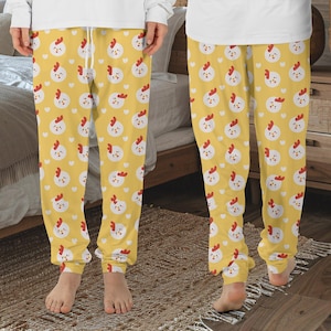 May include: Yellow pajama pants with a white and red chicken pattern.
