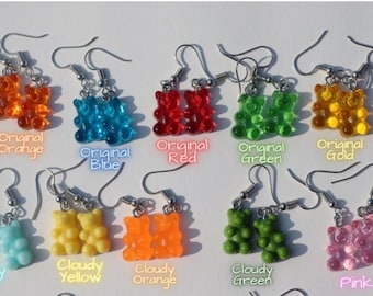 May include: A set of 10 pairs of gummy bear earrings in various colors, including original orange, blue, red, green, gold, cloudy blue, yellow, orange, green, and pink.