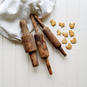 Antique wooden bread rolls, old rolling pins, primitive handmade object, rustic kitchen, old stuff, 19th century