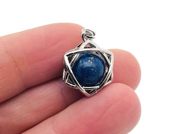 May include: A silver pendant featuring a six-pointed star design with a round blue lapis lazuli stone in the center.