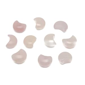 Puede incluir: Diez piedras de color rosa y blanco en forma de media luna. Las piedras son lisas y pulidas.