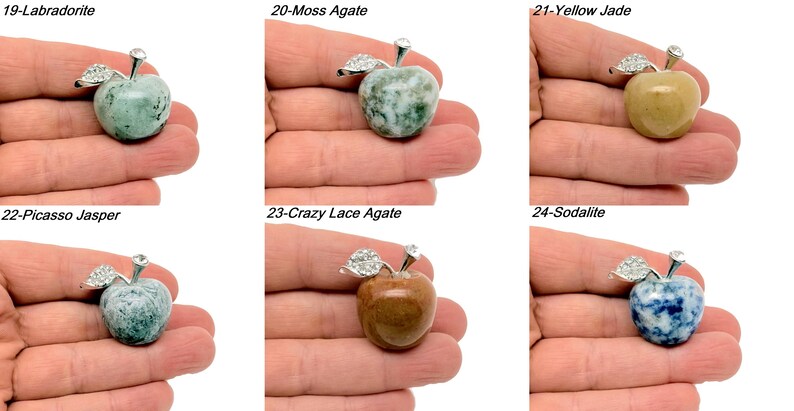 May include: Six different gemstone apple pendants, each with a silver setting and a silver stem. The gemstones are labradorite, moss agate, yellow jade, picasso jasper, crazy lace agate, and sodalite.
