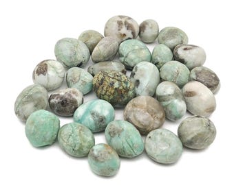 May include: A collection of tumbled green and white stones with a variety of patterns. The stones are smooth and polished, and they have a natural, earthy look.