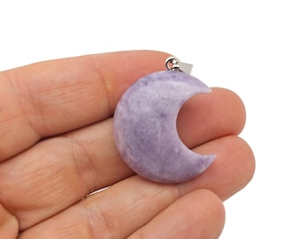 May include: A crescent moon pendant made of lavender amethyst with a silver bail.