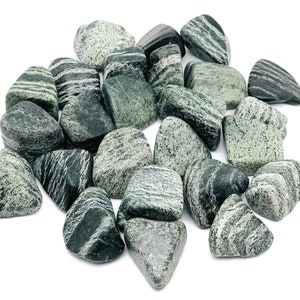 May include: A collection of smooth, green and black striped stones. The stones are tumbled and polished, creating a smooth, natural finish.