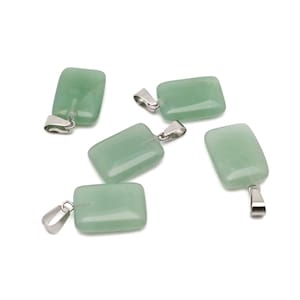 May include: Five green jade stone pendants with silver bail loops. The pendants are rectangular in shape and have a smooth, polished finish.