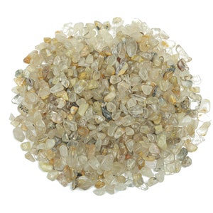 May include: A pile of small, clear quartz crystals with a slight golden hue. The crystals are tumbled and have a smooth, polished finish.