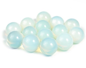 May include: A group of 15 smooth, iridescent, light blue opal spheres.