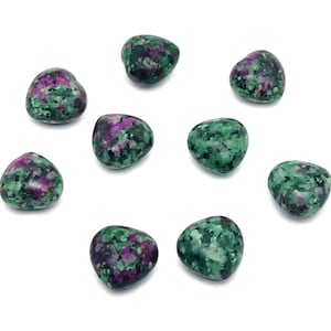 May include: Nine heart-shaped green and purple gemstones. The stones are polished and have a speckled appearance.