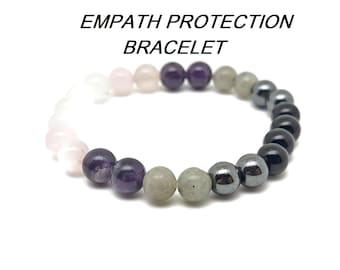 May include: Empath Protection Bracelet with pink, purple, grey, black, and silver beads.