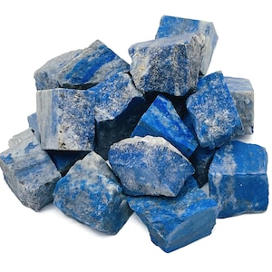 May include: A pile of rough, blue lapis lazuli stones. The stones are various sizes and shapes, with some showing white veins.