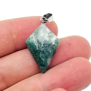 May include: A green and white agate gemstone pendant with a silver bail. The pendant is shaped like a diamond and has a natural, organic pattern.