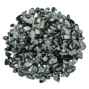 May include: A pile of black and white snowflake obsidian tumbled stones. The stones are smooth and polished, with a variety of shapes and sizes.