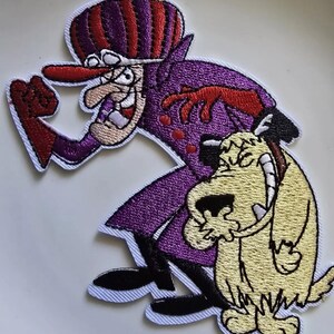 May include: Embroidered patch depicting a cartoon villain in a purple coat and hat with a red and purple striped design. The villain is grinning and has a long red nose. A smiling yellow dog is next to the villain.