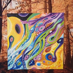 May include: Abstract painting on canvas with a colorful, swirling design. The painting features a mix of yellow, blue, green, purple, and white colors. The design is reminiscent of a galaxy or a cosmic landscape.