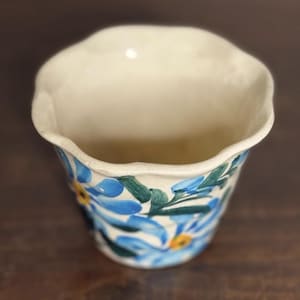 May include: A set of three ceramic mugs with a speckled, matte finish. The mugs are in shades of cream, light gray, and dark gray. Each mug has a simple, minimalist design, perfect for coffee or tea.