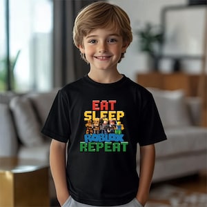 a young boy wearing a black t - shirt with the words eat sleep and think