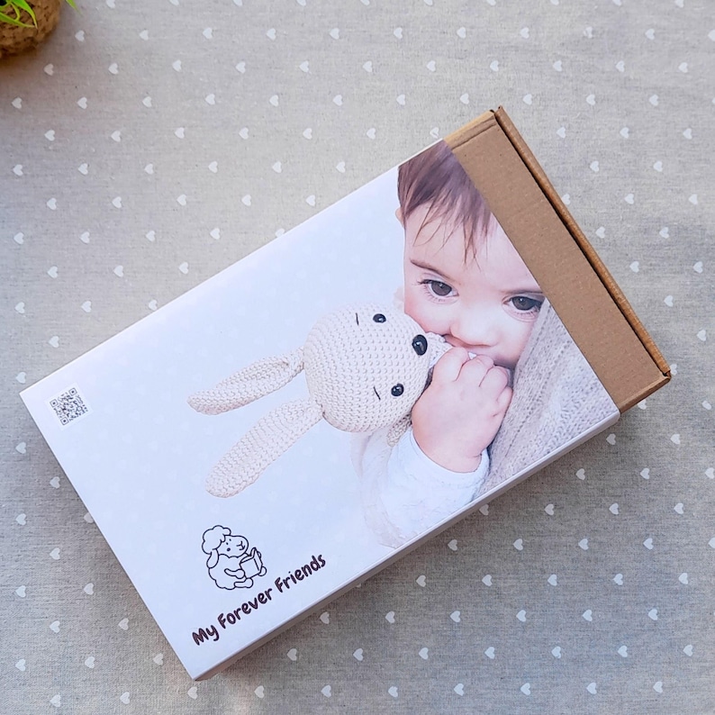 Kraft band with natural tones used for eco-friendly gift wrapping of artisan baby toys.