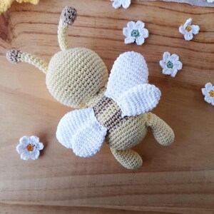 Handmade cotton bee plush viewed from behind, artisan crochet details