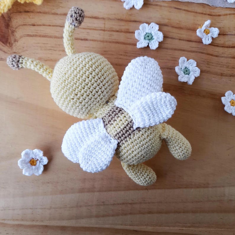 Handmade cotton bee plush viewed from behind, artisan crochet details