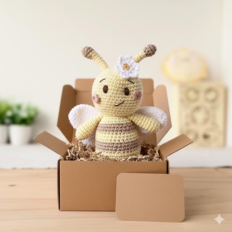 Bee plush presented inside a kraft gift box with tissue paper, organic handmade cuddle toy.