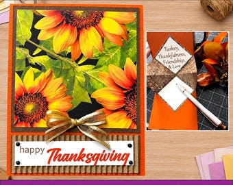 May include: A DIY Thanksgiving card kit featuring a completed card with a sunflower print, a gold ribbon, and a white label reading happy Thanksgiving. An inset shows a folded orange card with a diamond-shaped insert text Turkey, Thankfulness, Friendship, & Love.