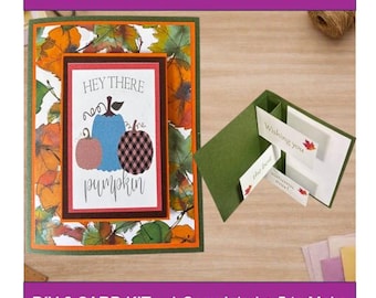 May include: A DIY card kit featuring a folded greeting card with a fall leaf pattern and a central panel displaying three pumpkins and the text Hey There Pumpkin. A second open card shows a green interior with pop-up panels reading Wishing you the best autumn ever.