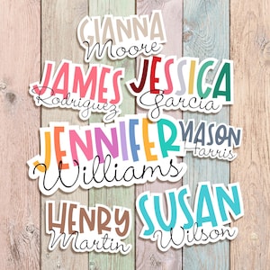 May include: A collection of colorful name stickers with the text "FRIENDLY TREE STICKERS." Names include Gianna Moore, James Rodriguez, Jessica Garcia, Jennifer Williams, Henry Martin, Susan Wilson. The stickers are permanent and waterproof.